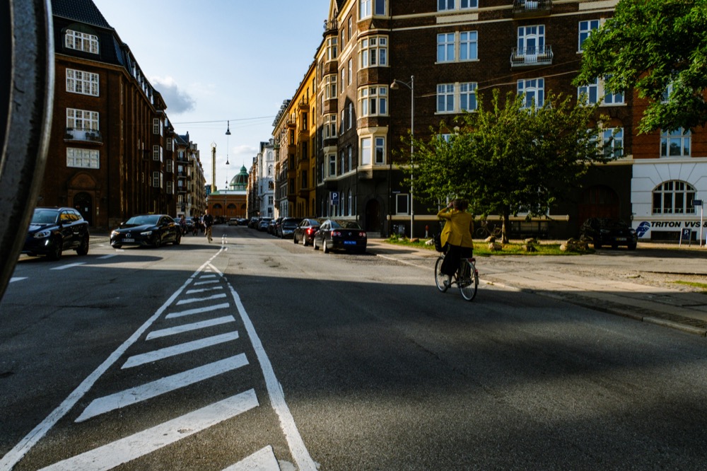 A cyclist on a quiet residential street